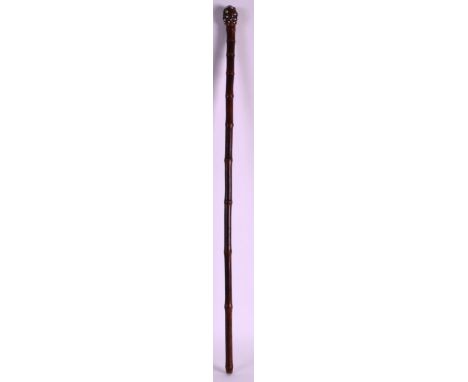 AN UNUSUAL 19TH CENTURY SILVER INSET BAMBOO SWAGGER STICK with knurled terminal. 2ft 4.5ins long.