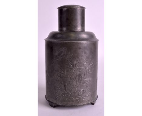 A CHINESE REPUBLICAN PERIOD HUIKEE SWATOW PEWETER TEA CADDY AND COVER incised with calligraphy and flowers. 6.75ins high. 