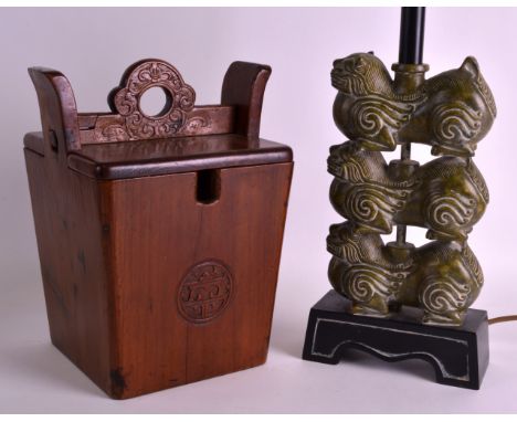AN EARLY 20TH CENTURY CHINESE CARVED WOOD BUCKET together with a triple buddhistic lion lamp. (2)