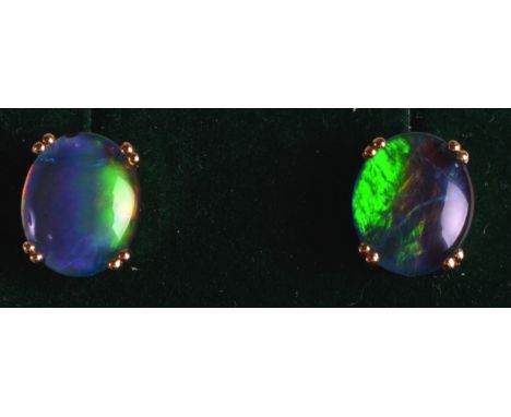 A LOVELY PAIR OF 9CT YELLOW GOLD LADIES FIERY OPAL EARRINGS. 