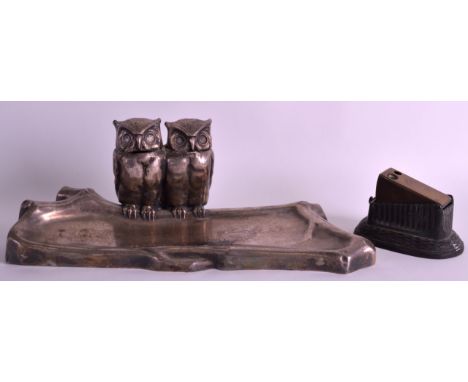 AN EARLY 20TH CENTURY AUSTRIAN SILVER PLATED GENTLEMANS INKWELL in the form of two perched owls over a pool, together with an