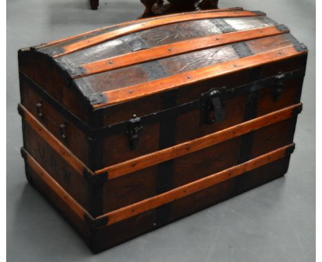 AN EARLY 20TH CENTURY DOME TOP WOODEN TRUNK incised with star motifs and initialled URW. 2ft 9ins x 1ft 10ins. 