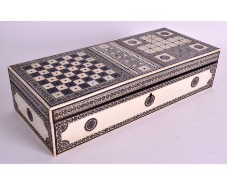 A MID 19TH CENTURY ANGLO-INDIAN VIZAGAPATAM TRAVELLING GAMING BOARD inlaid with mosaic, the playing pieces kept within a comp