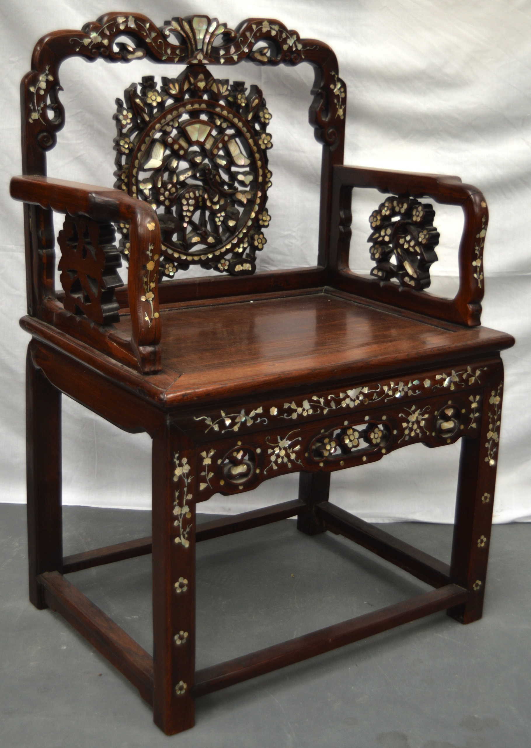 AN EARLY 20TH CENTURY CHINESE HARDWOOD MOTHER OF PEARL INLAID ARM CHAIR