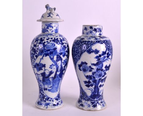 A 19TH CENTURY CHINESE BLUE AND WHITE BALUSTER VASE bearing Kangxi marks to base, together with another similar vase & cover.