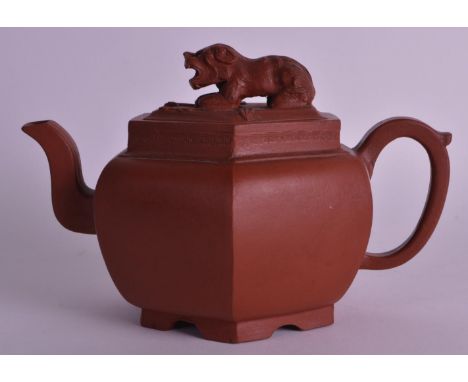 A GOOD 18TH CENTURY CHINESE YIXING POTTERY TEAPOT AND COVER Kangxi/Yongzheng, of hexagonal form, with buddhistic lion finial.