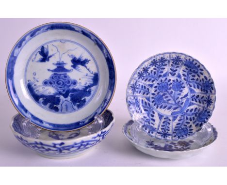 A 17TH CENTURY CHINESE BLUE AND WHITE CIRCULAR SAUCER Kangxi, together with three others. Largest 4.75ins diameter. (4)