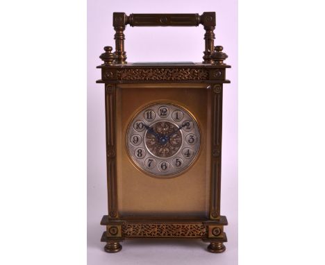 A LATE 19TH CENTURY FRENCH BRASS CARRIAGE CLOCK with pierced foliate mounts and silvered dial. 