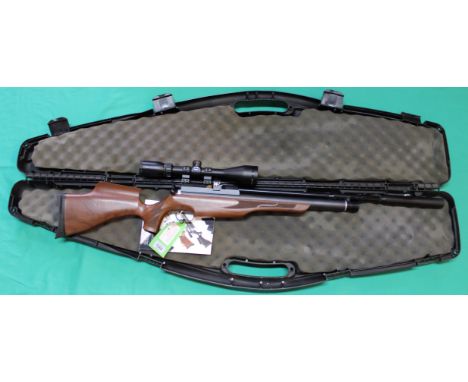 A Daystate X2 .177 cal P.C.P. air rifle, complete with Hawke 4-12x50 scope, sound moderator and original booklet, in overall 