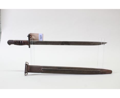 A Remington model 1917 bayonet with scabbard