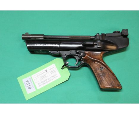 A Webley &amp; Scott 'Hurricane' .22 cal air pistol with brown plastic grips and cast number 2066A, as a post 1939 air weapon