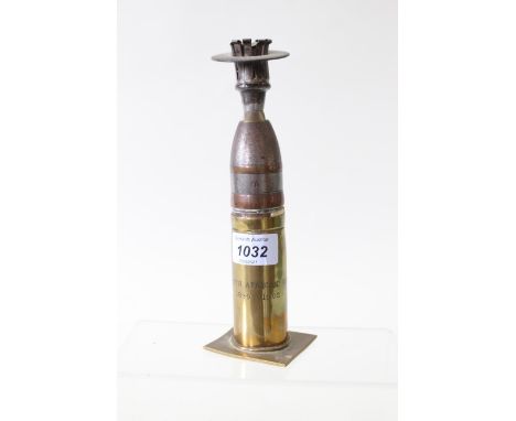 A 'Trench Art' candlestick crafted from a pom-pom case and head, case marked South African War 1899-1902