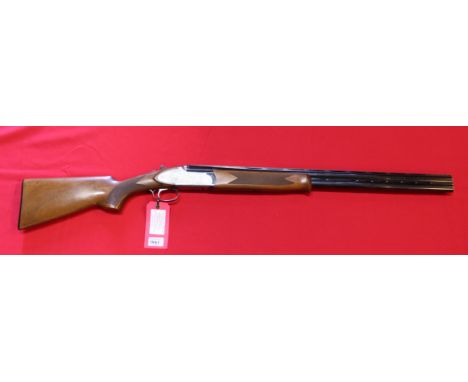 A 12 bore O/U shotgun by Bettinsoli, S/No.66064, in overall good condition with 28" barrels and engraved action (N.B. this is