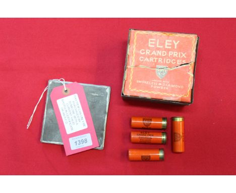 A box containing four 'Eley Grand Prix' 12 bore cartridges within rare tropical tin (park label in place), this item can only