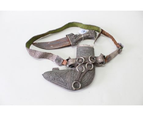 A Saudi Arabian jambiya dagger with white metal granulation embellishment to hilt and sheath, this very fine example also has
