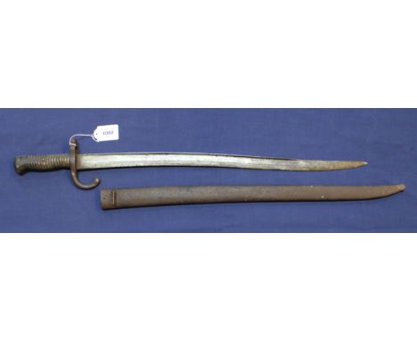 A French model 1866 sabre bayonet dated 1868 with scabbard (a worn example)