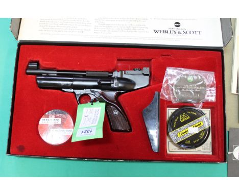 A Webley &amp; Scott .22 cal Typhoon air pistol with brown grips, in overall very good condition, in original box and outer b