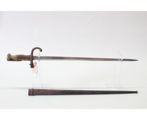 A French model 1874 Epee bayonet with scabbard, matching numbers, with very good blade dated 1880 (wooden grip as found)