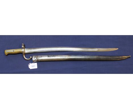 A French model 1866 sabre bayonet with scabbard, blade dated 1871 and maker marked, a good clean example