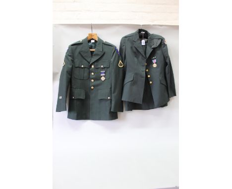 Two USA army uniforms including a ladies example