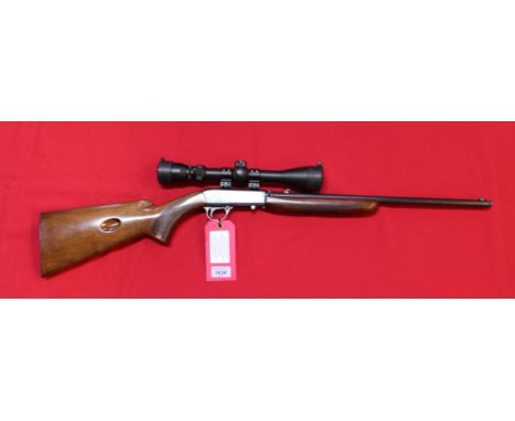 A self-loading .22 R/F cal rifle by F.N., S/No.52073, complete with scope and a good clean 'take-down' example, this item can