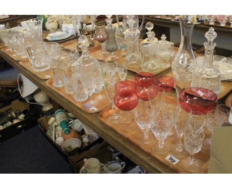 Four trays of assorted glassware to include: various drinking vessels; cut glass tumblers; decanter and stopper; Cranberry gl