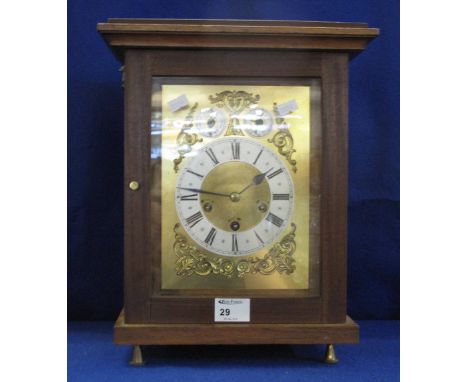 Early 20th Century, later cased, three train mantel clock with brass face and silvered chapter ring.