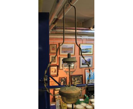 Brass hanging tilly lamp with clear glass shade.