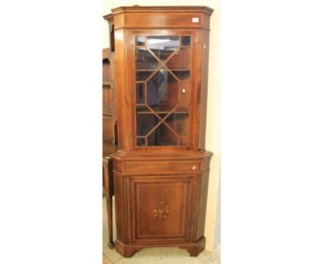 Edwardian mahogany, astragal glazed, corner cabinet on bracket feet.