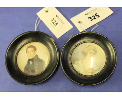 Pair of early 19th Century portrait miniatures on ivory, a young naval officer and young woman.  Ebonised frames.