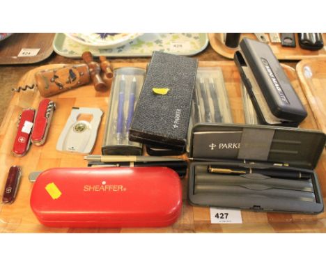 Tray of assorted collectables to include: Swiss Army penknives; treen corkscrew; various pens, some in boxes to include: Park