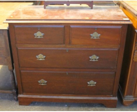 Edwardian oak dressing table or chest of two short and two long drawers on bracket feet.