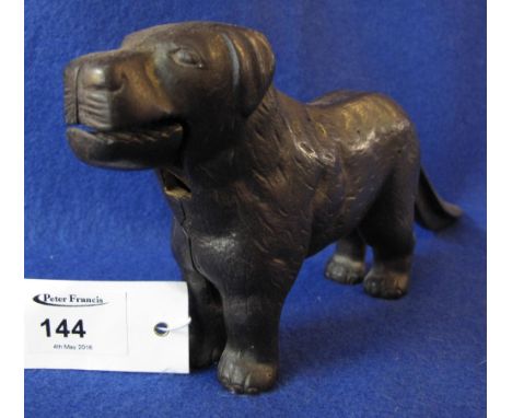 Cast metal dog shaped nut cracker.