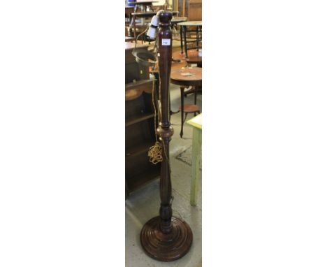20th Century stained baluster standard lamp on circular stepped base.
