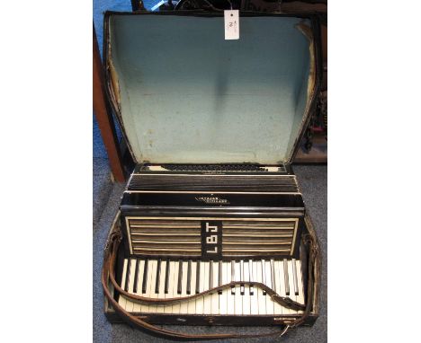 Settimo Soprani piano accordion in original carrying case.