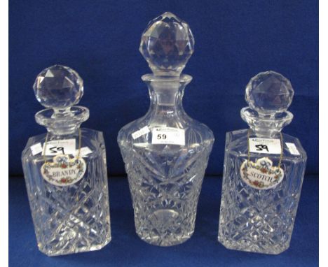 Pair of star cut, lead crystal, square section spirit decanters together with another star cut, lead crystal baluster shaped 