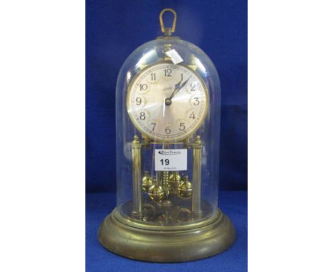 Schatz gilt brass hundred day, perpetual motion dome clock with silvered face.