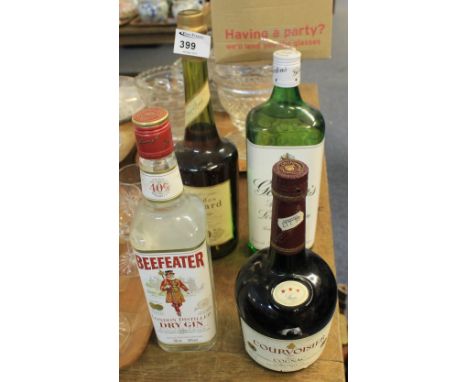 Gordon's Special Dry London Gin; Beefeater London Dry Gin; Courvoisier Cognac and bottle of Calvados. (4)