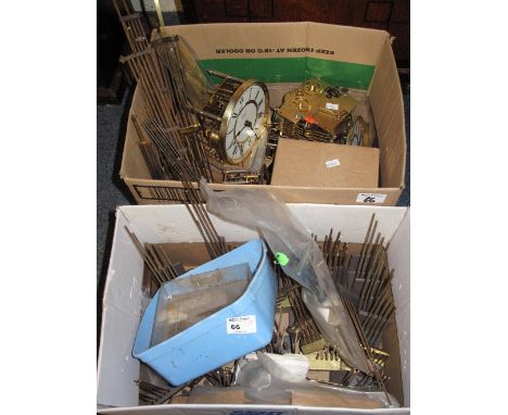 Two boxes of clock parts, movements, faces, gongs, pendulums etc.