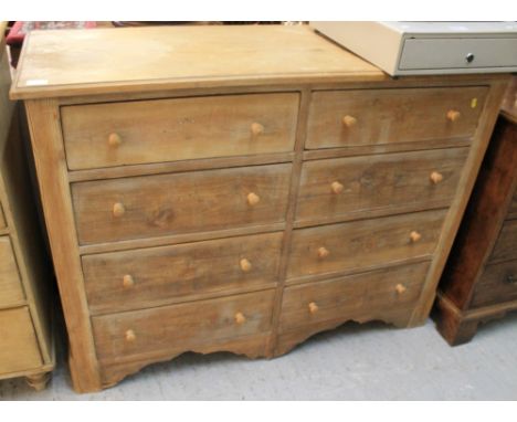 Pine straight front chest of eight drawers on bracket feet.