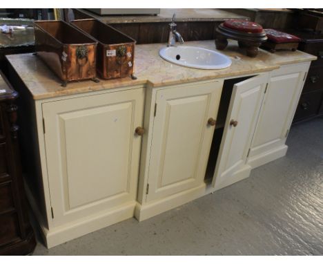 Modern painted pine break front vanity unit with single tap and ceramic sink with a marble top base.