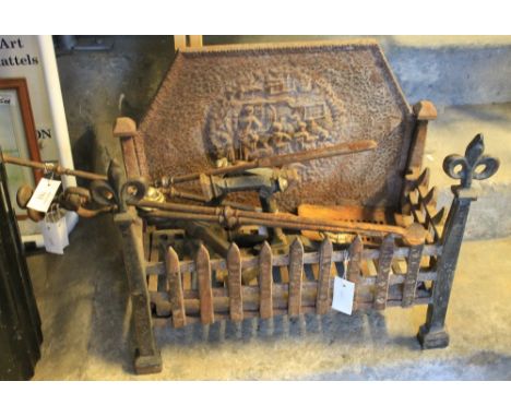 Vintage cast iron grate with various tools including: poker; tongs; fire dogs etc.