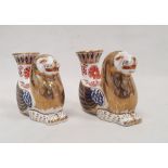 Pair of Royal Crown Derby bone china imari pattern mythical beast candlesticks, each modelled as a