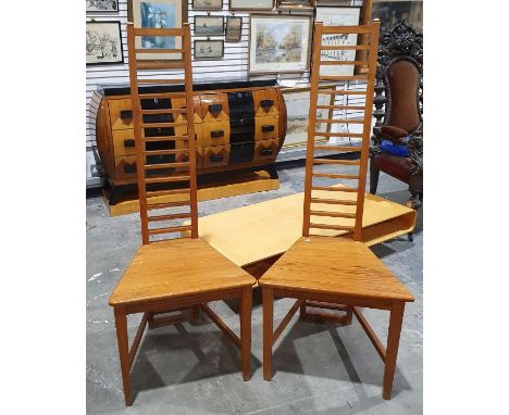 Set of four pine high ladder backed dining chairs on tapering supports.