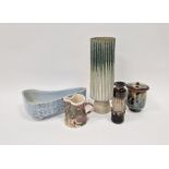 Stephen Parry-Thomas studio pottery jug with mottled red and green glaze on cream ground,