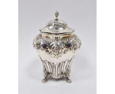 Victorian silver tea caddy with domed top, shouldered and tapering with floral repousse, four paw feet, 15cm high, Chester 18