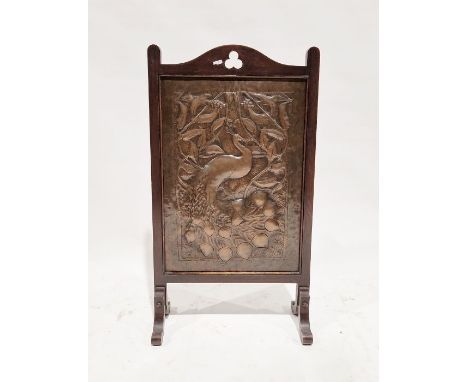 Early 20th century Art Nouveau hammered copper firescreen depicting a peacock perched on a vine, mounted in a stained wooden 