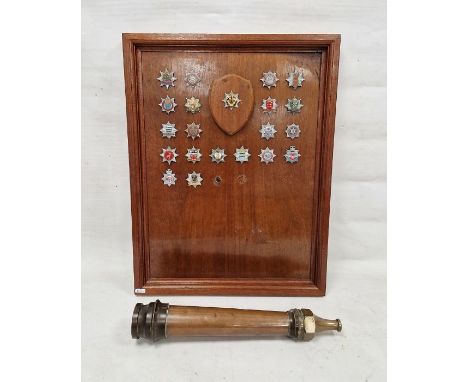 Mid-20th century wooden panel&nbsp;mounted with Fire Brigade badges including examples from Hertfordshire, Wiltshire, Notting