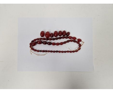 String of red amber-coloured graduated oval beads Condition Report Some beads with light surface marks, no obvious pattern, v