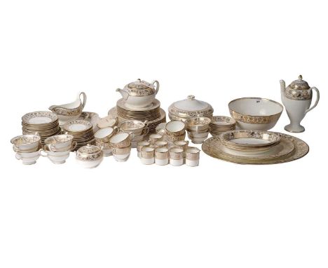 A Wedgwood ‘Gold Florentine’ pattern tea and dinner service, including: a sauce boat and saucer, dinner plates, serving plate